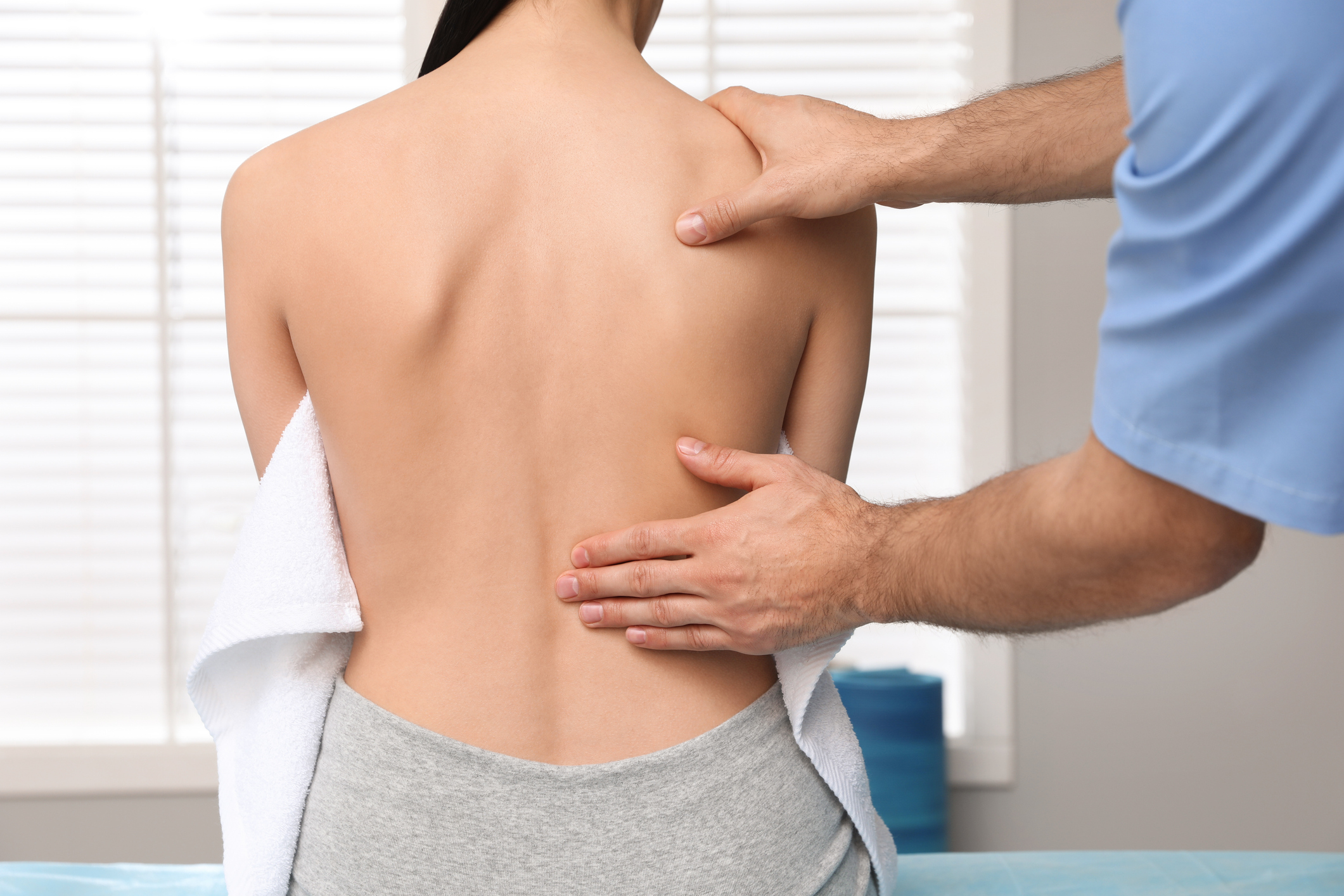 Image of physio helping with back pain