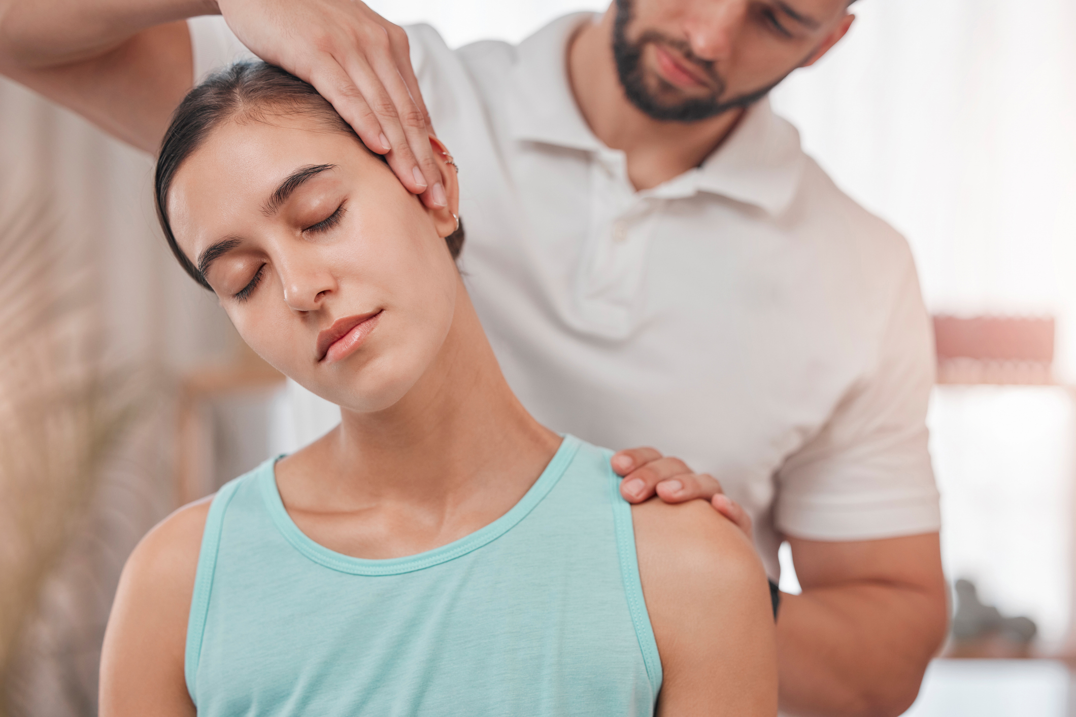 Image of physio helping with neck pain