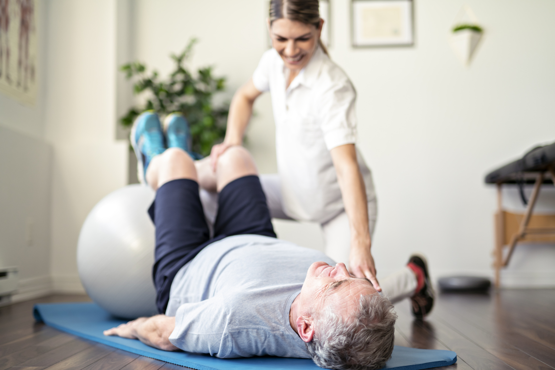 Image of physio helping with back pain